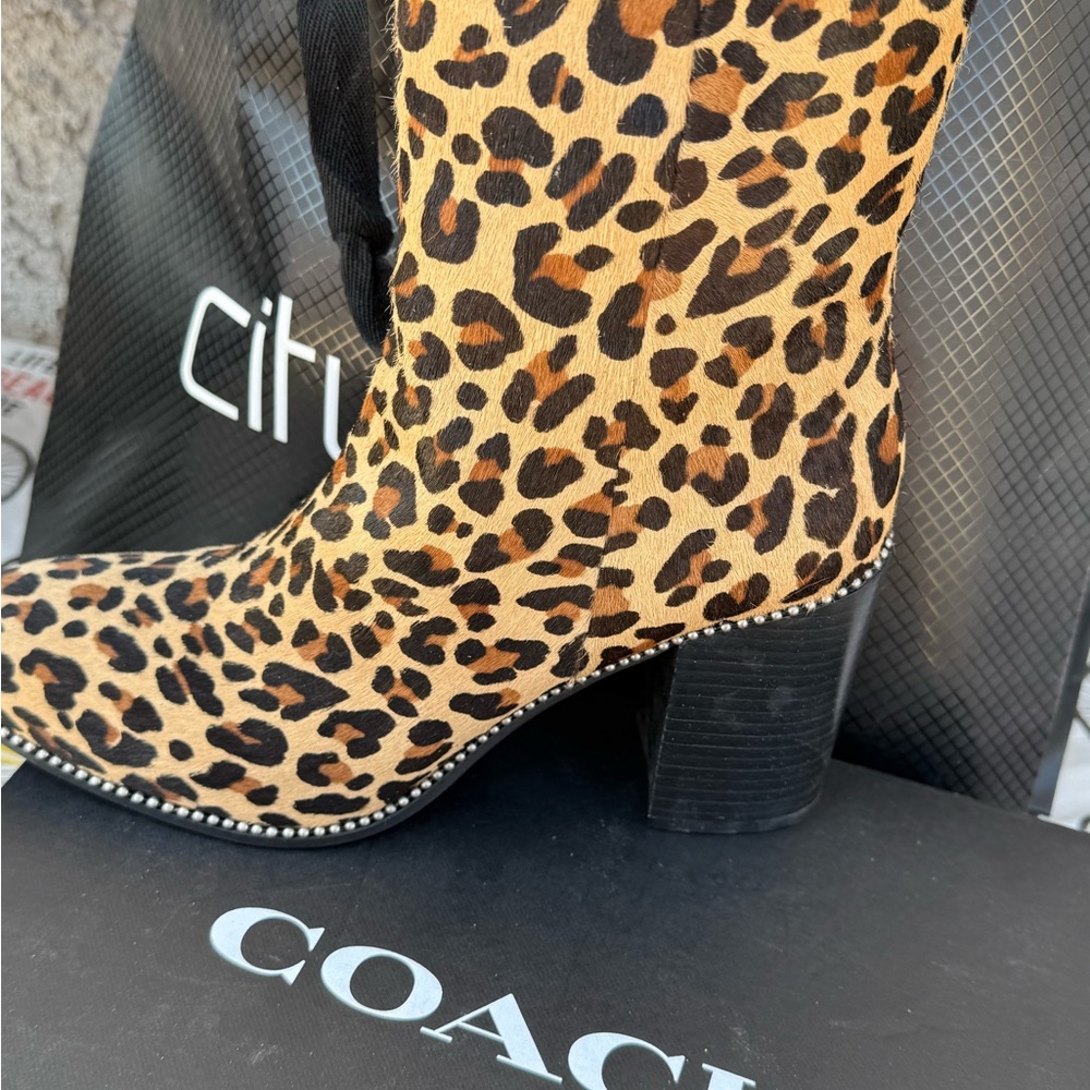 Coach Black and Tan Heeled Boots with Sleek Silhouette